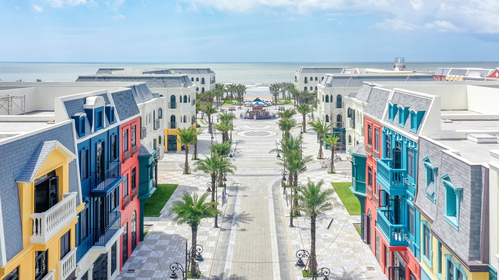 A street with many colorful buildingsDescription automatically generated